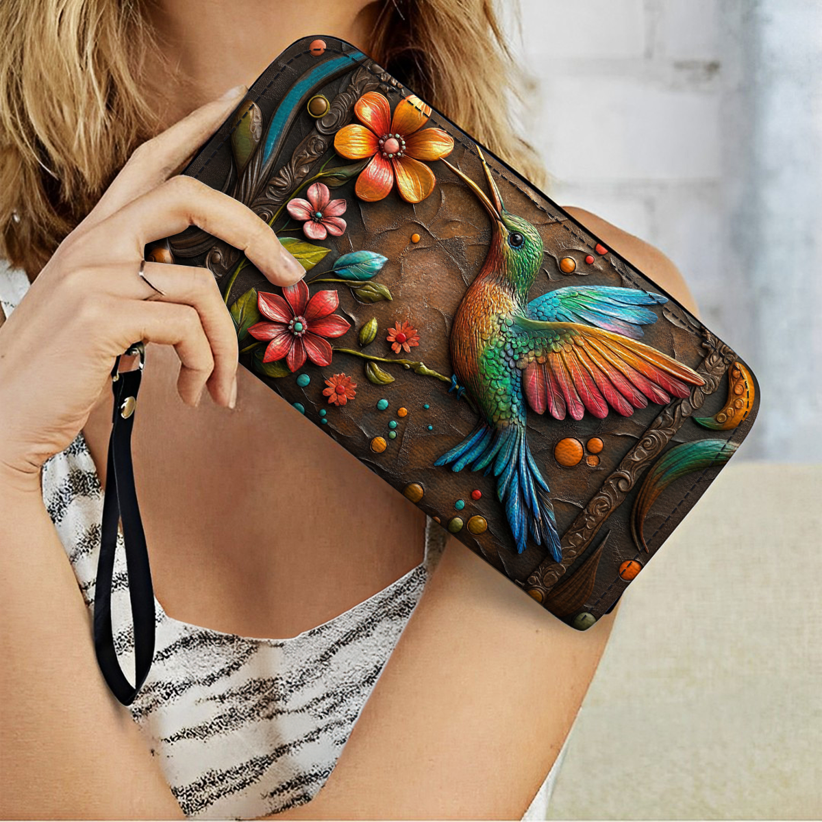 Pochette en cuir brillante avec dragonne et poignée motif colibri et fleur