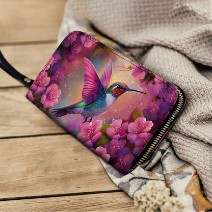 Pochette en cuir brillante avec dragonne et poignée Motif colibri en fleurs