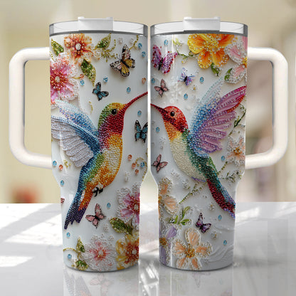 Glänzender, glänzender Becher mit Blumen-Kolibri und Schmetterlingen