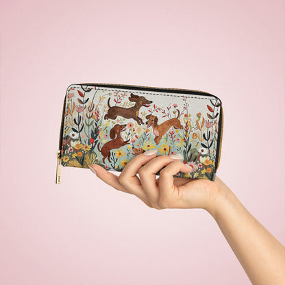 Pochette en cuir brillante avec dragonne et poignée motif teckel floral