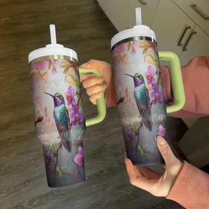 Glänzender Becher mit Orchideenkolibri