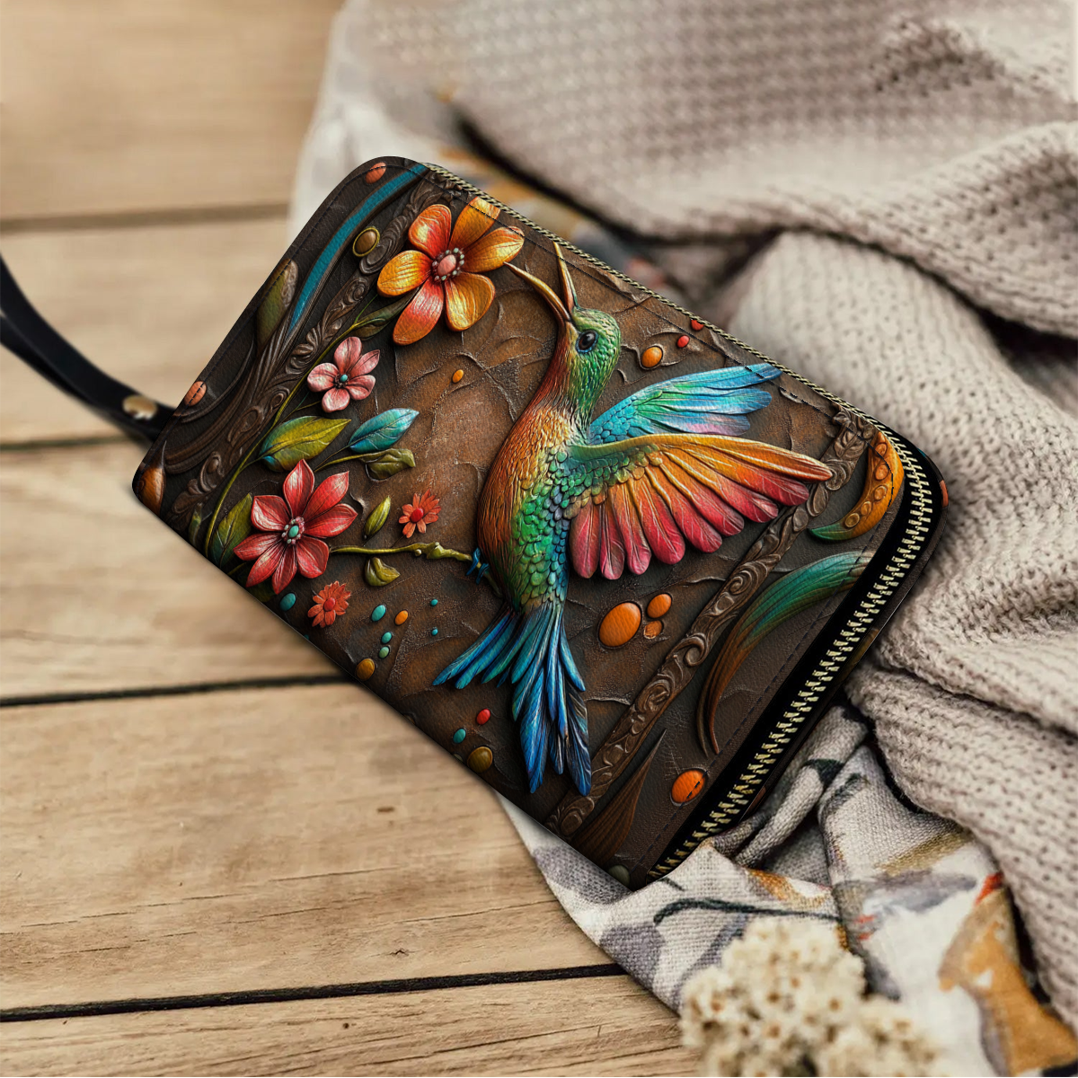 Pochette en cuir brillante avec dragonne et poignée motif colibri et fleur