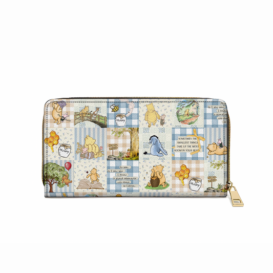 Pochette en cuir brillante avec dragonne et breloque Winnie l'ourson