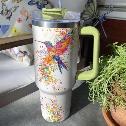 Glänzender Becher mit Kolibri und Blumenmotiv