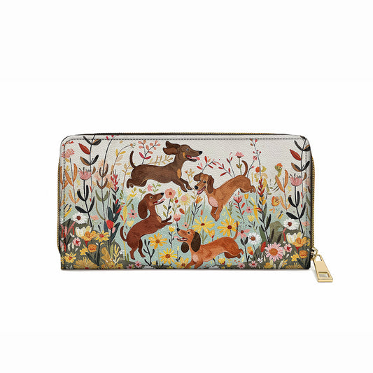 Pochette en cuir brillante avec dragonne et poignée motif teckel floral