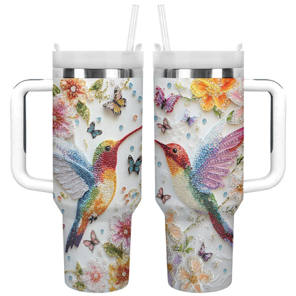 Glänzender, glänzender Becher mit Blumen-Kolibri und Schmetterlingen