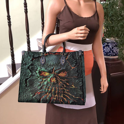 Sac en cuir brillant de luxe avec tête de mort brisée